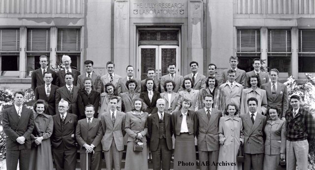 The Class of 49 stands on steps for a photo