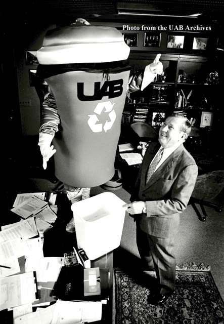 Trash Gordon, UAB's recycling mascot, stands next to President Charles A. McCallum Jr.