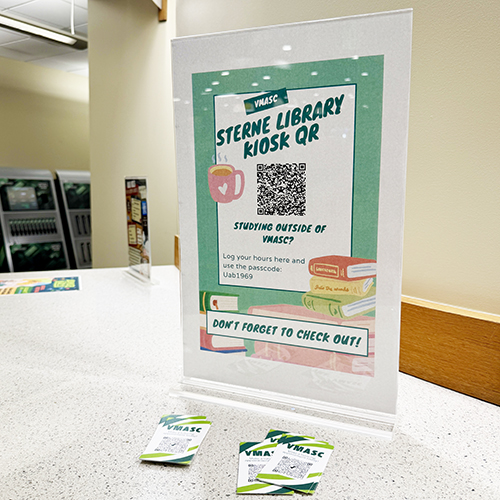 Image of flyer in plastic holder sitting on counter.