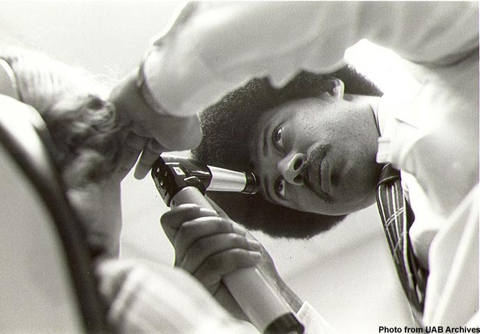 Optometrist examines a patient