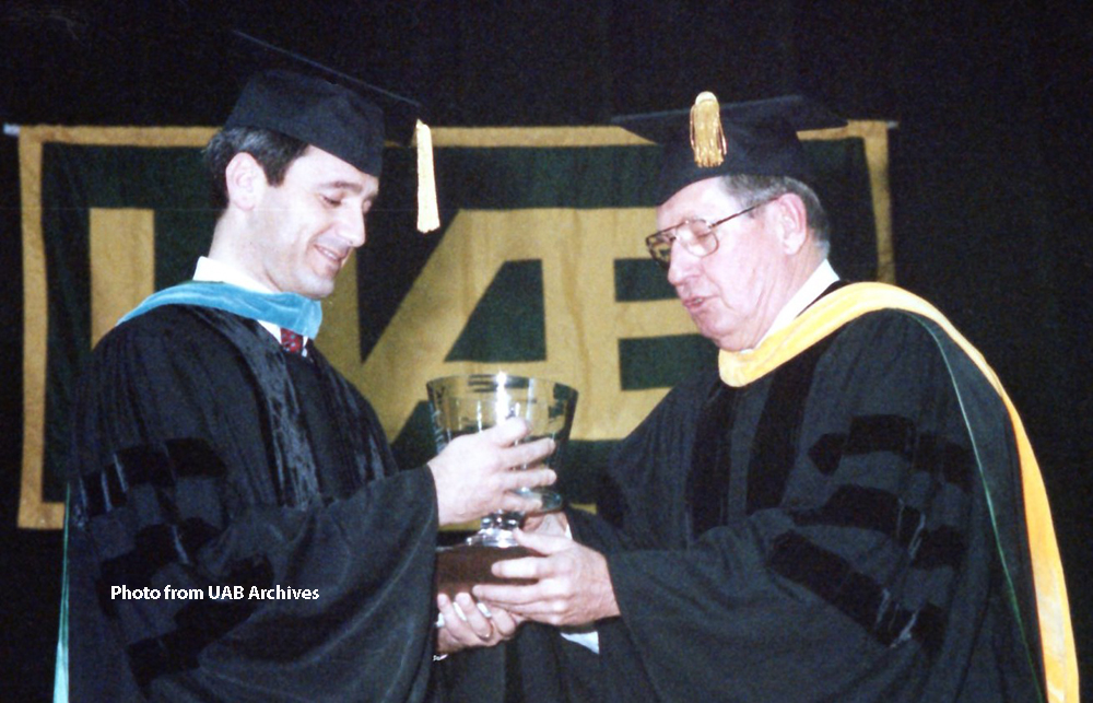 Dr. Larry DeLucas receives the inaugural Distinguished Alumnus Award, December 1991