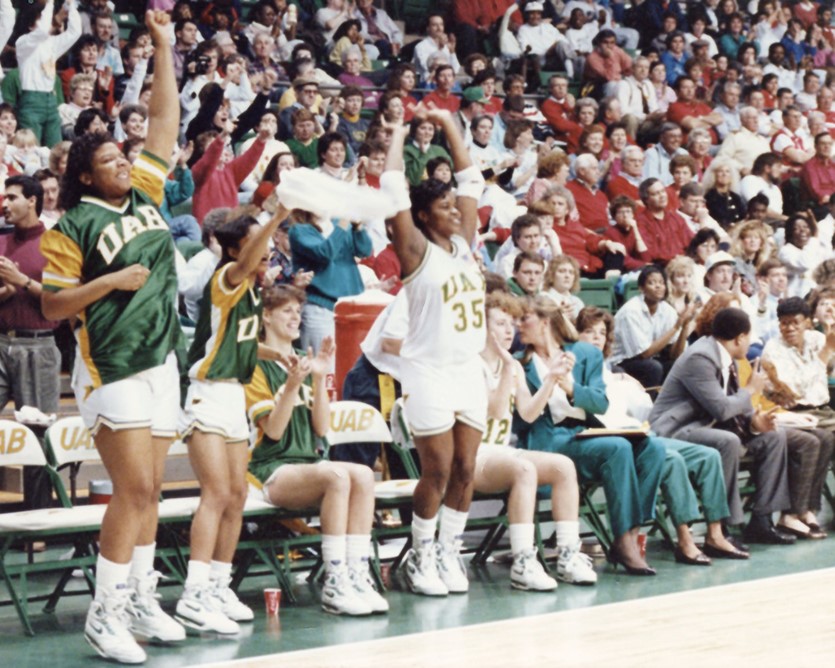 UAB Blazer Women's Basketball team celebrates courtside, circa 1991