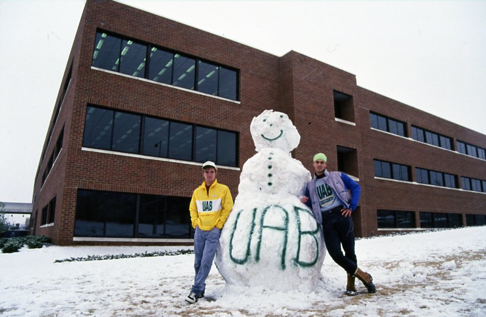 UAB students with a large snowman outside of the Mervyn Sterne Library